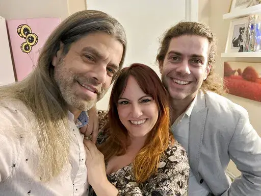 This image provided by Ryan Cohen shows, from left, Ryan Cohen, his wife, Emily Taffel, and Taffel's former boyfriend, Sam Rubman, on Feb. 3, 2022, in Coral Springs, Fla. In the era of intense cybersecurity and calls for multifactor lockdown of all things digital, the three share several logins to streaming services. (Ryan Cohen via AP).