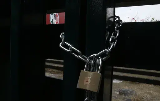 The doors of the headquarters of Mexico's Institutional Revolutionary Party, PRI, remain closed with chains in Mexico City, Wednesday, June 30, 2021. The PRI has been reduced to a shadow of its former self by the rise of President Andrés Manuel López Obrador's Morena party, which won the governorship of the last major PRI bastion, the State of Mexico, on June 2023. (AP Photo/Marco Ugarte, File)