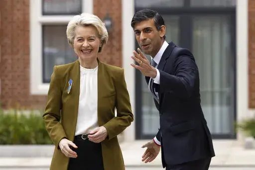 Britain's Prime Minister Rishi Sunak, right, greets European Commission President Ursula von der Leyen at the Fairmont Hotel in Windsor, England, Monday Feb. 27, 2023. The U.K. and the European Union were poised Monday to end years of wrangling and seal a deal to resolve their thorny post-Brexit trade dispute over Northern Ireland. Striking an agreement at a meeting with European Commission President Ursula von der Leyen would be a big victory for Prime Minister Rishi Sunak — but not the end o