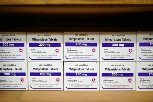 Boxes of the drug mifepristone line a shelf at the West Alabama Women's Center in Tuscaloosa, Ala., on Wednesday, March 16, 2022. The drug is one of two used together in "medication abortions."   On Friday, June 17,  The Associated Press reported on stories circulating online incorrectly claiming medication abortions are dangerous.  (AP Photo/Allen G. Breed, File)
