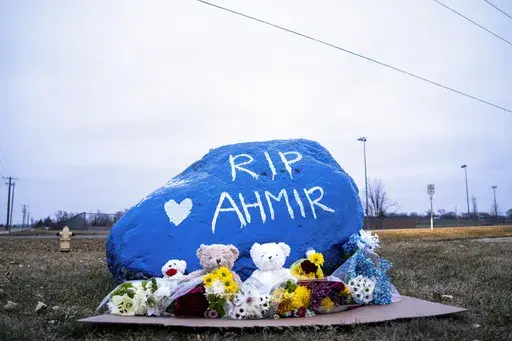 A rock is painted to memorialize Perry High School shooting victim Ahmir Jolliff at the school on Saturday, Jan. 6, 2024, in Perry, Iowa. (Lily Smith/The Des Moines Register via AP)