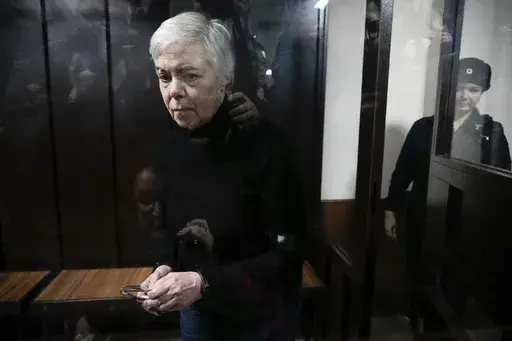 Paediatrician Nadezhda Buyanova, accused of spreading false information about the army, attends a hearing in the Tushinsky District Court in Moscow, Russia, Tuesday, Nov. 12, 2024. (AP Photo/Pavel Bednyakov)