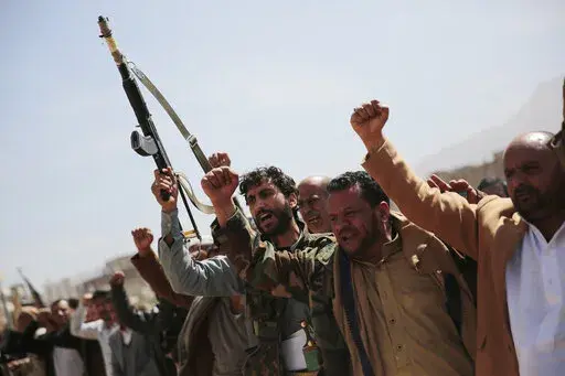 Armed Houthi fighters attend the funeral procession of Houthi rebel fighters who were killed in recent fighting with forces of Yemen's internationally recognized government, in Sanaa, Yemen, on Nov. 24, 2021. A clan-based militia government in the Arab world's poorest country is presenting the Biden administration with its latest foreign policy frustrations. Yemen's Houthis have launched three cross-border strikes with drones and ballistic missiles into the United Arab Emirates in as many weeks.