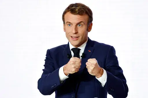 French President Emmanuel Macron gestures as he delivers a speech during a press conference on France assuming EU presidency, Thursday, Dec. 9, 2021 in Paris. President Emmanuel Macron has provoked outcries in parliament and shrill protests from election rivals by using a vulgarity to describe his strategy for pressuring vaccine refusers to get coronavirus jabs. (Ludovic Marin/Pool Photo via AP, File)