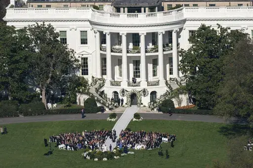 President Joe Biden's granddaughter Naomi Biden and her fiance, Peter Neal, are married on the South Lawn of the White House in Washington, Saturday, Nov. 19, 2022. (AP Photo/Carolyn Kaster)