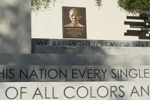 Words decorate the concrete steps up to a bronze plate with the likeness of former President Barack Obama at the Plaza where then student Obama made his first political speech "A Protest against Apartheid" on Feb. 18, 1981, at Occidental College in Los Angeles, seen on Thursday, July 27, 2023. Occidental College is the latest school to end legacy admissions in the wake of a Supreme Court decision removing race from admissions decisions. (AP Photo/Damian Dovarganes)