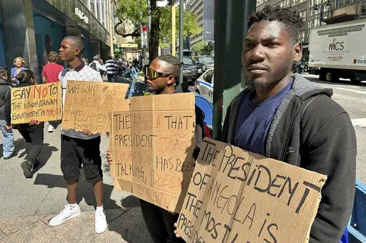 From right, Daniel Pedro, Edison Gilberto and Domingo Rafael, demonstrate against Angola's ruling party, Tuesday, Sept. 19, 2023, in New York. The U.N. General Assembly, the most inherently international event, is also the most American. It's a place where people raised unfree come to speak out because they can. In official protest locations and just plain street corners this week, the heavily secured streets outside the United Nations complex were filled this week with people who said they were
