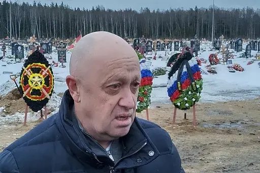 Wagner Group head Yevgeny Prigozhin attends the funeral of Dmitry Menshikov, a fighter of the Wagner group who died during a special operation in Ukraine, at the Beloostrovskoye cemetery outside St. Petersburg, Russia, on Dec. 24, 2022. Prigozhin's criticism of the top military brass is in stark contrast with more than two decades of rigidly controlled rule by President Vladimir Putin without any sign of infighting among his top lieutenants. (AP Photo, File)