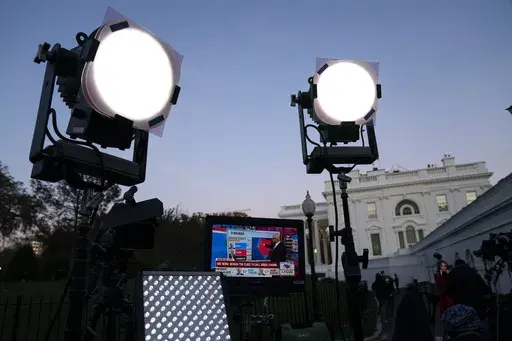 Media organizations set up outside the White House, Friday, Nov. 6, 2020, in Washington. (AP Photo/Evan Vucci, File)