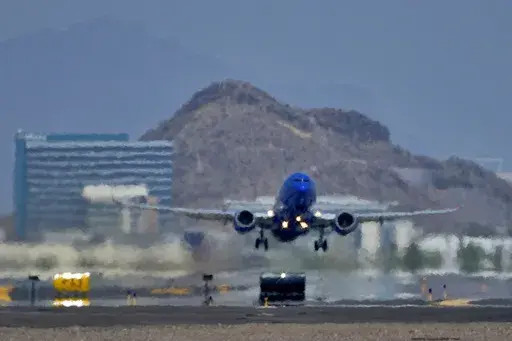 A jet takes flight as heat ripples radiate from the runway, Tuesday, July 25, 2023 at Sky Harbor International Airport, in Phoenix. The city so far this year has seen 52 days of highs at 110 degrees or over and is expected to hit that mark again on both Saturday, Sept. 9, and Sunday. (AP Photo/Matt York)