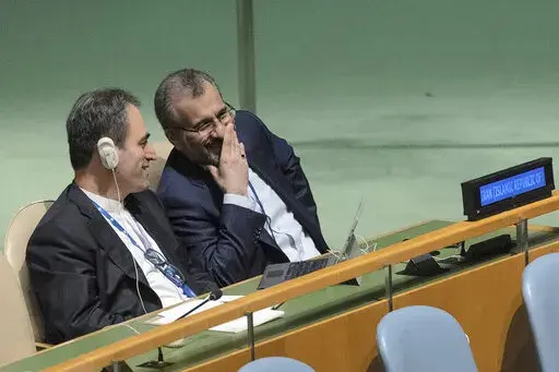 Iran's delegates look at each other while U.S. Secretary of State Antony J. Blinken addresses the 2022 Nuclear Non-Proliferation Treaty (NPT) review conference, in the United Nations General Assembly, Aug. 1, 2022. Last week's attack on author Salman Rushdie and the indictment of an Iranian national for plotting to murder former national security adviser John Bolton have given the Biden administration new headaches as it attempts to negotiate a return to the 2015 nuclear deal with Iran. (AP Phot