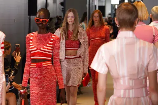 Models wear creations as part of the Benetton women's Spring Summer 2023 collection presented in Milan, Italy, Sunday, Sept. 25, 2022. (AP Photo/Alberto Pezzali)