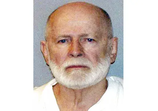 This June 23, 2011, file booking photo provided by the U.S. Marshals Service shows James "Whitey" Bulger. Three men, including a Mafia hitman, have been charged in the killing of Bulger in a West Virginia prison. The Justice Department announced the charges against Fotios "Freddy" Geas, Paul J. DeCologero and Sean McKinnon on Thursday, Aug. 18, 2022. (U.S. Marshals Service via AP, File)