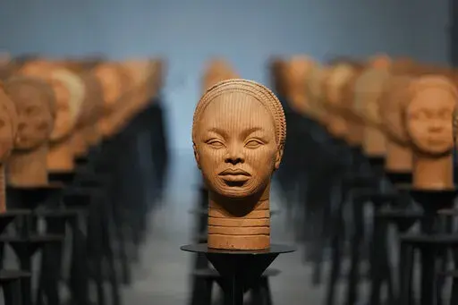 Sculptures created by French artist Prune Nourry, Inspired by ancient Nigerian Ife terracotta heads, titled "Statues Also Breathe," and representing the remaining 108 Chibok still in captivity are displayed in Lagos, Nigeria, Tuesday, Dec. 13, 2022. On April 14, 2014, Boko Haram stormed the Government Girls Secondary School in the Chibok community in Borno state and forcefully took the girls as they prepared for science exams, sparking the #BringBackOurGirls social media campaign that involved c