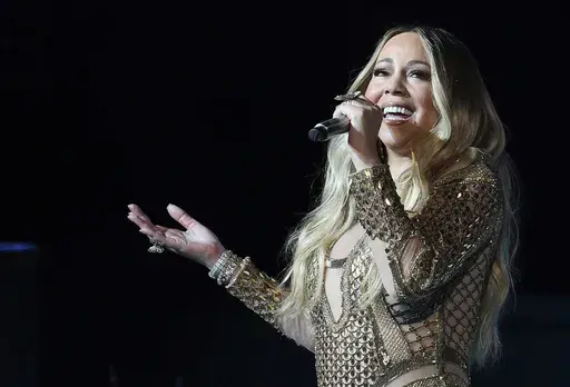 Mariah Carey performs during a concert celebrating Dubai Expo 2020 One Year to Go in Dubai, United Arab Emirates on Oct. 20, 2019. (AP Photo/Kamran Jebreili, File)