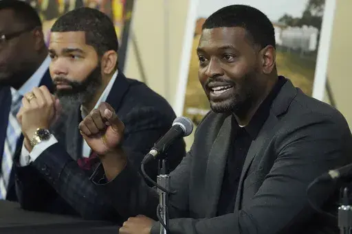 EPA Administrator Michael S. Regan, right, addresses a roundtable of Jackson-area businesspeople, community leaders, residents and educators, as Jackson Mayor Chokwe Antar Lumumba, left, listens, Nov. 15, 2022, at Jackson State University, in Jackson, Miss. The EPA said Monday, May 6, 2024, that it found “insufficient evidence” that racial discrimination shaped decisions made by two Mississippi agencies about water system funding for the majority-Black city of Jackson. (AP Photo/Rogelio V. S
