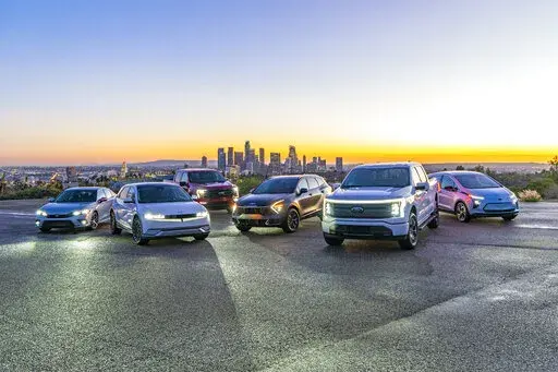 This undated photo provided by Edmunds shows their top rated car, SUV, truck and an electric version for each category. (Rex Tokeshi-Torres/Edmunds via AP)