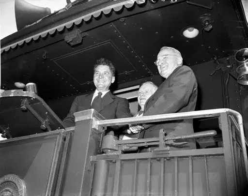 A group of Ohio democratic leaders greet President Truman when his train stopped briefly at Crestline, Ohio, June 4, 1948. Standing with Truman is Former Gov. Frank J. Lausche, right, and Albert A. Horstman, former democratic chairman. (AP Photo, File)