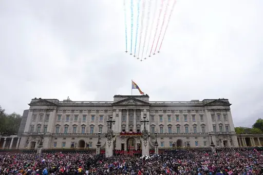 Britain's King Charles III and Queen Camilla on the balcony of Buckingham Palace watch the Royal Air Force Red Arrows fly over after their coronation ceremony, in London, on May 6, 2023. A change in monarchs, double-digit inflation and ongoing costs of renovating Buckingham Palace contributed to a 5% increase in publicly-funded spending by Britain's royals, royal accounts published Thursday, June 29, 2023 showed. (AP Photo/Petr David Josek, File)