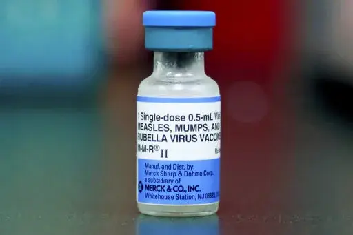 This Friday, May 17, 2019 file photo shows a vial of a measles, mumps and rubella vaccine in Mount Vernon, Ohio. According to a report released by the Centers for Disease Control and Prevention on Thursday, April 21, 2022, a smaller portion of U.S. children got routine vaccinations required for kindergarten during the pandemic, raising concerns that measles and other preventable diseases could increase. (AP Photo/Paul Vernon, File)