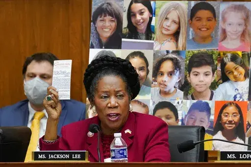 With photos of the young victims in Uvalde, Texas, behind her, Rep. Sheila Jackson Lee, D-Texas, speaks in support of Democratic gun control measures, called the Protecting Our Kids Act, in response to mass shootings in Texas and New York, at the Capitol in Washington, Thursday, June 2, 2022. (AP Photo/J. Scott Applewhite)