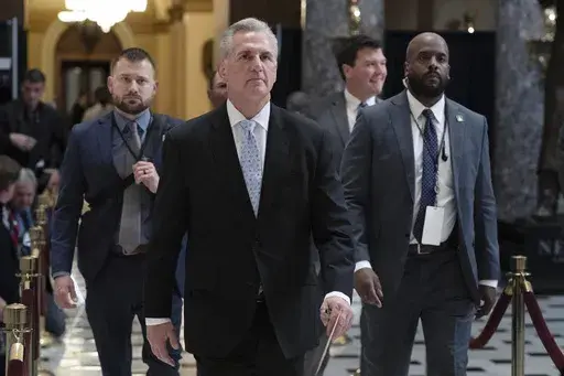 Speaker of the House Kevin McCarthy, R-Calif., walks inside the Capitol in Washington, Thursday, April 27, 2023. House Republicans have narrowly passed a sweeping debt ceiling package as they try to push President Biden into negotiations on federal spending. (AP Photo/Jose Luis Magana)