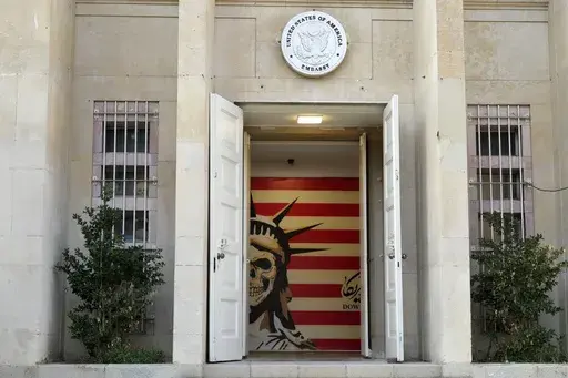 The entrance to the former U.S. Embassy, which has been turned into an anti-American museum, is seen in Tehran, Iran, on Saturday, Aug. 19, 2023. U.S. porn actor Whitney Wright, who has advocated for Palestinians online during Israel's war on Hamas, traveled to Iran in Feb. 2024 and visited the former U.S. Embassy in Tehran abandoned after the 1979 hostage crisis. The visit by Wright has sparked heated criticism over the country's crackdown on women since the 2022 death in police custody of Mahs