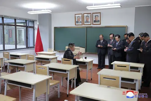 In this photo provided by the North Korean government, North Korean leader Kim Jong Un, left, inspects a class room of a newly built central cadres training school in Pyongyang, North Korea, Tuesday, May 21, 2024. Independent journalists were not given access to cover the event depicted in this image distributed by the North Korean government. The content of this image is as provided and cannot be independently verified. Korean language watermark on image as provided by source reads: "KCNA" whic