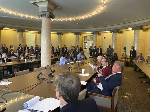 Mississippi state Rep. Fred Shanks, middle, red blazer, sits in a legislative hearing at the state Capitol in Jackson, Miss., Tuesday, Feb, 28, 2023. Shanks chairs the House Constitution Committee, which advanced a proposal Tuesday that would ban voters from launching ballot initiatives related to abortion. (AP Photo/Michael Goldberg)