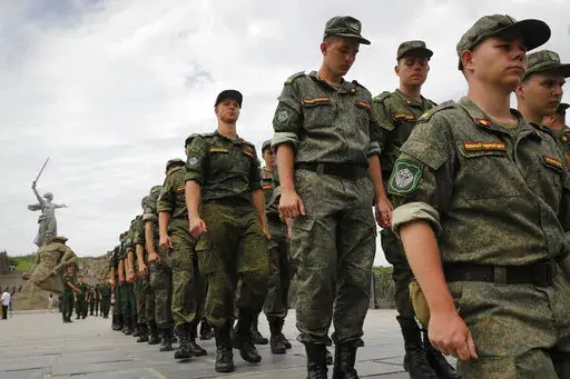 Russian army soldiers march during an action in support for the soldiers involved in the military operation in Ukraine, at the Mamaev Kurgan, a World War II memorial in Volgograd, Russia, July 11, 2022. Russian President Vladimir Putin has on Thursday, Aug. 25 ordered the Russian military to increase the size of the country's armed forces by 137,000 amid Moscow’s military action in Ukraine. (AP Photo/Alexandr Kulikov, file)