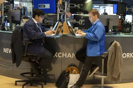 People work on the New York Stock Exchange trading floor in New York on November 21, 2024. (AP Photo/Ted Shaffrey, File)