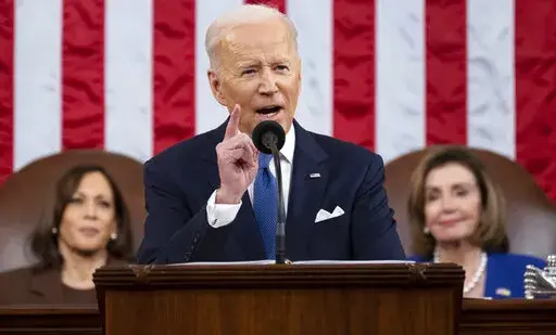 President Joe Biden delivers his first State of the Union address to a joint session of Congress at the Capitol, as Vice President Kamala Harris and House Speaker Nancy Pelosi of Calif., watch, Tuesday, March 1, 2022, in Washington.  Biden has a new plan to expand mental health and drug abuse treatment. He proposes pouring hundreds of millions of taxpayer dollars into suicide prevention, mental health services for youth, and community clinics providing 24/7 access to people in crisis. (Saul Loeb