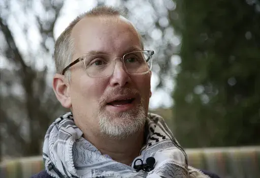 Rich Price, the uncle of 20-year-old Hisham Arwatani, speaks in an interview at the University of Vermont Medical Center in Burlington, Vt., on Friday, Dec. 1, 2023, where his nephew has been hospitalized since a Nov. 25, 2023, triple shooting being investigated as a possible hate crime. Arwatani, a math and archaeology student at Brown University, was wounded along with two friends also of Palestinian descent on a residential street just off the UVM campus in Burlington. (AP Photo/Hasan Jamali)
