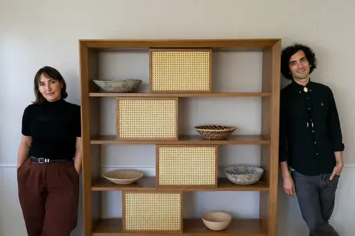 Neon White co-creator and game director Ben Esposito, right, and co-creator Geneva Hodgson pose for photos in Glendale, Calif., Monday, Dec. 5, 2022. Neon White is nominated for "Best Indie" in Thursday's Game Awards, the Oscars of the video game industry. (AP Photo/Jae C. Hong)