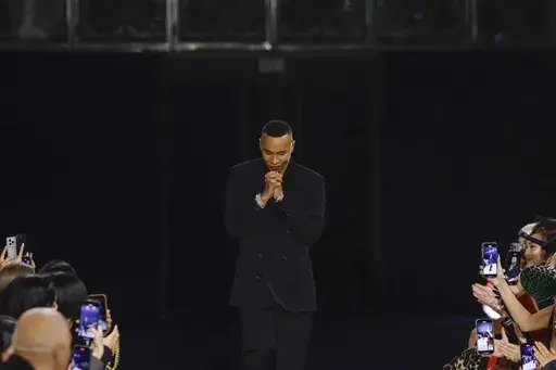 Designer Olivier Rousteing accepts applause after the conclusion of the Balmain Fall/Winter 2023-2024 ready-to-wear collection presented Wednesday, March 1, 2023 in Paris. Balmain artistic director Olivier Rousteing says robbers have made off with more than 50 pieces of the new collection that his Paris house intends to show at Fashion Week later this month. (Vianney Le Caer/Invision/AP, file)
