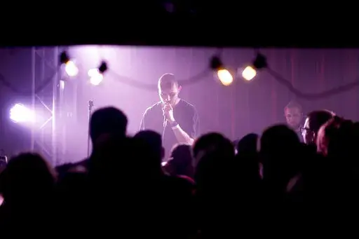 Viacheslav Drofa, known as Otoy, performs during a concert to raise funds for soldiers fighting for Ukraine in Kyiv, Ukraine, Sunday, June 5, 2022. From the battlefronts of Ukraine comes rap music — filled with the anger and indignation of a young generation that, once the fighting is done, will certainly never forget and may never forgive.Ukrainian rapper-turned-volunteer soldier Otoy is putting the war into words and thumping baselines, tapping out lyrics under Russian shelling on his phone,