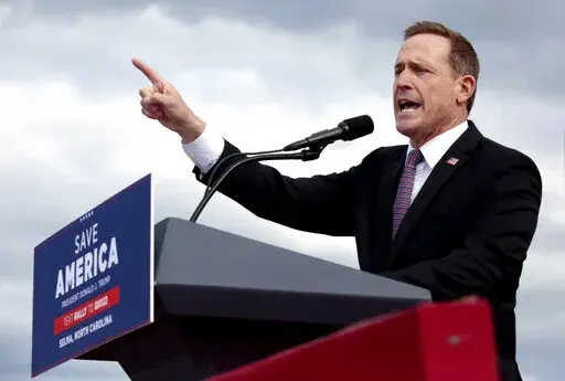 Republican candidate for U.S. Senate, Rep. Ted Budd, R-N.C., addresses a crowd before former President Donald Trump speaks at a rally, April 9, 2022, in Selma, N.C. Budd is leaning into support for abortion restrictions and amity for the former Republican president as Democrats fight for an elusive victory in the Southern swing state. Budd is set to appear alongside Trump, Friday, Sept. 23, 2022, at a rally in Wilmington, N.C. (AP Photo/Chris Seward, File)