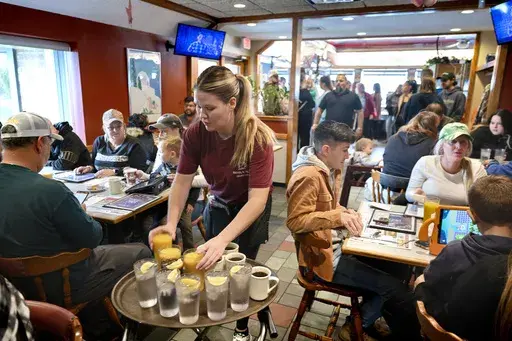 Waitress Rachel Gurcik serves customers at the Gateway Diner in Westville, Pa. on Oct. 22, 2023. On Friday, April 5, 2024, the U.S. government issues its March jobs report. (Tom Gralish/The Philadelphia Inquirer via AP, File)