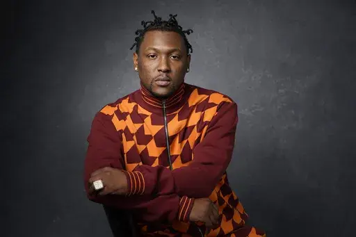 Record producer and recording artist Hit-Boy poses for a portrait, Tuesday, March 8, 2022, in Los Angeles. When Hit-Boy walks the Grammy red carpet, he expects to proudly strut into the Feb. 4, 2024 awards ceremony with his father beside him for the first time. (AP Photo/Chris Pizzello, File)