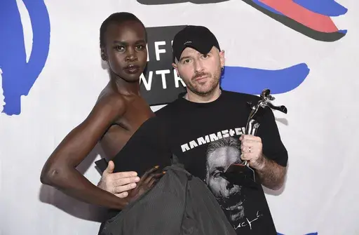 FILE Alek Wek, left, poses in the press room with Demna Gvasalia, winner of the international award, at the CFDA Fashion Awards at the Hammerstein Ballroom, June 5, 2017, in New York. (Photo by Evan Agostini/Invision/AP, File)