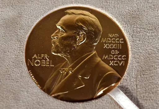 A Tuesday, Dec. 8, 2020 file photo of a Nobel medal displayed during a ceremony in New York. (Angela Weiss/Pool Photo via AP, File)
