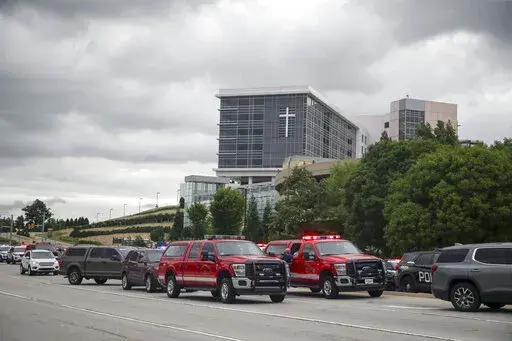 Tulsa police and firefighters respond to a shooting at the Natalie Medical Building Wednesday, June 1, 2022. in Tulsa, Okla. Multiple people were shot at a Tulsa medical building on a hospital campus Wednesday. (Ian Maule/Tulsa World via AP)