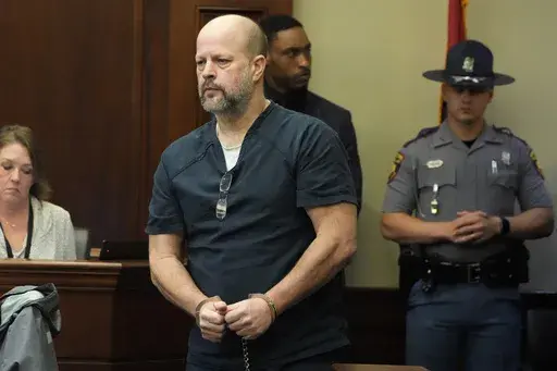 Brett McAlpin, one of six former Mississippi law enforcement officers who pleaded guilty to a long list of state and federal charges enters the Rankin County Circuit Court for the state sentencing for his involvement in the 2023 racially motivated torture of two Black men, April 10, 2024, in Brandon, Miss. (AP Photo/Rogelio V. Solis, file)