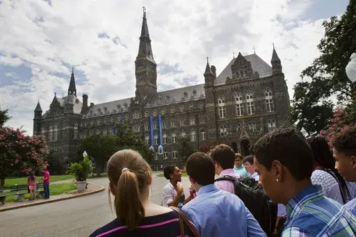 In this July 10, 2013, file photo, prospective students tour Georgetown University's campus in Washington. (AP Photo/Jacquelyn Martin, File)