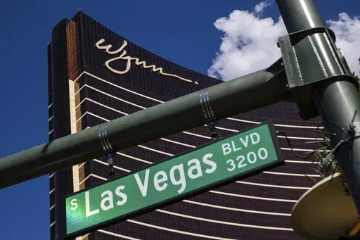 The Wynn Las Vegas resort stands over the Las Vegas strip, July 26, 2023, in Las Vegas. According to court documents filed Tuesday, Sept. 5, 2023, Wynn Resorts and nine unnamed women have told a federal judge that they're settling a lawsuit alleging the casino company failed to investigate allegations that female employees had been sexually harassed by former company CEO Steve Wynn. (AP Photo/Ty ONeil, File)