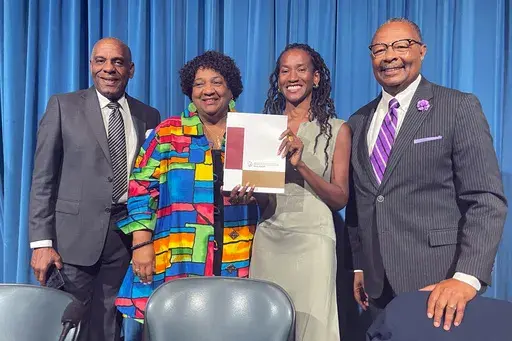 From left, State Sen. Steven Bradford, Secretary of State Shirley Weber, task force member Lisa Holder and Assemblymember Reggie Jones-Sawyer hold up a final report of the California Task Force to Study and Develop Reparation Proposals for African Americans during a hearing in Sacramento, Calif., Thursday, June 29, 2023. The report heads to lawmakers who will be responsible for turning policy recommendations into legislation. Reparations will not happen until lawmakers and Gov. Gavin Newsom agre