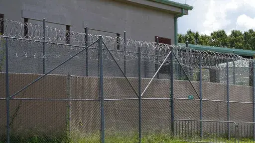 Rolls of razor wire line the top of the security fencing at the Raymond Detention Center in Raymond, Miss., on Aug. 1, 2022. Mississippi’s largest county secured a legal victory Wednesday, Dec. 28, in its effort to stave off a rare federal takeover of its jail, where a judge found “ongoing unconstitutional conditions" for inmates. (AP Photo/Rogelio V. Solis, File)