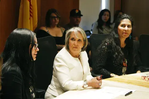New Mexico Gov. Michelle Lujan Grisham, center, announced an executive order aimed at ensuring safe harbor to people seeking abortions or providing abortions at health care facilities within the state, at a news conference in Santa Fe, N.M., on Monday, June 27, 2022. Lujan Grisham has signed a new executive order that pledges $10 million to build a clinic that would provide abortions and other pregnancy care. She said Wednesday, Aug. 31, 2022, that "the goal here is build it and they will come."