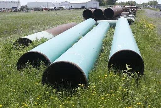Pipeline used to carry crude oil sits at the Superior, Wis., terminal of Enbridge Energy, June 29, 2018. Attorneys for a Wisconsin Native American tribe are set to argue Thursday, May 18, 2023, that a federal judge should order an energy company to shut down an oil pipeline the tribe says is at immediate risk of being exposed by erosion and rupturing on reservation land. (AP Photo/Jim Mone, File)