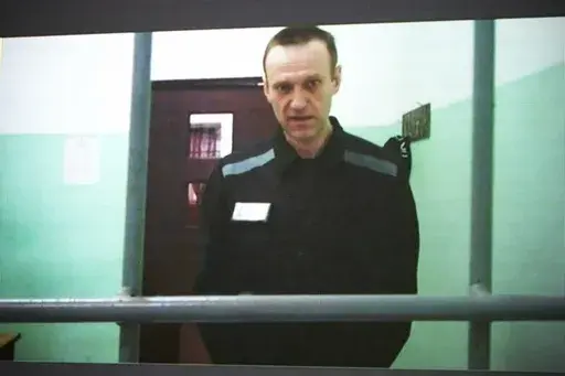Russian opposition leader Alexei Navalny is seen on a TV screen as he appears in a video link provided by the Russian Federal Penitentiary Service from the colony in Melekhovo, Vladimir region, during a hearing at the Russian Supreme Court in Moscow, Russia, on June 22, 2023. The Kremlin on Tuesday Dec. 12, 2023 bristled at the U.S. voicing concern about Navalny who has vanished from his prison colony, denouncing it as “inadmissible interference” in the country's domestic affairs. Worries ab